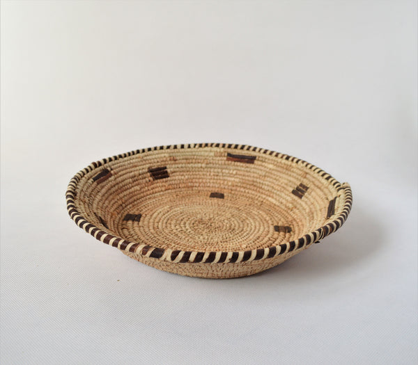 Woven straw and leather plate